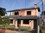 A mesma casa simulada em tom salmão